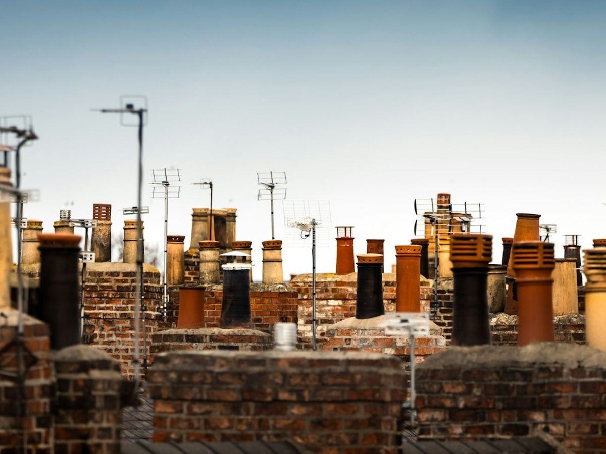 Rows of chimney pots on UK terraced houses