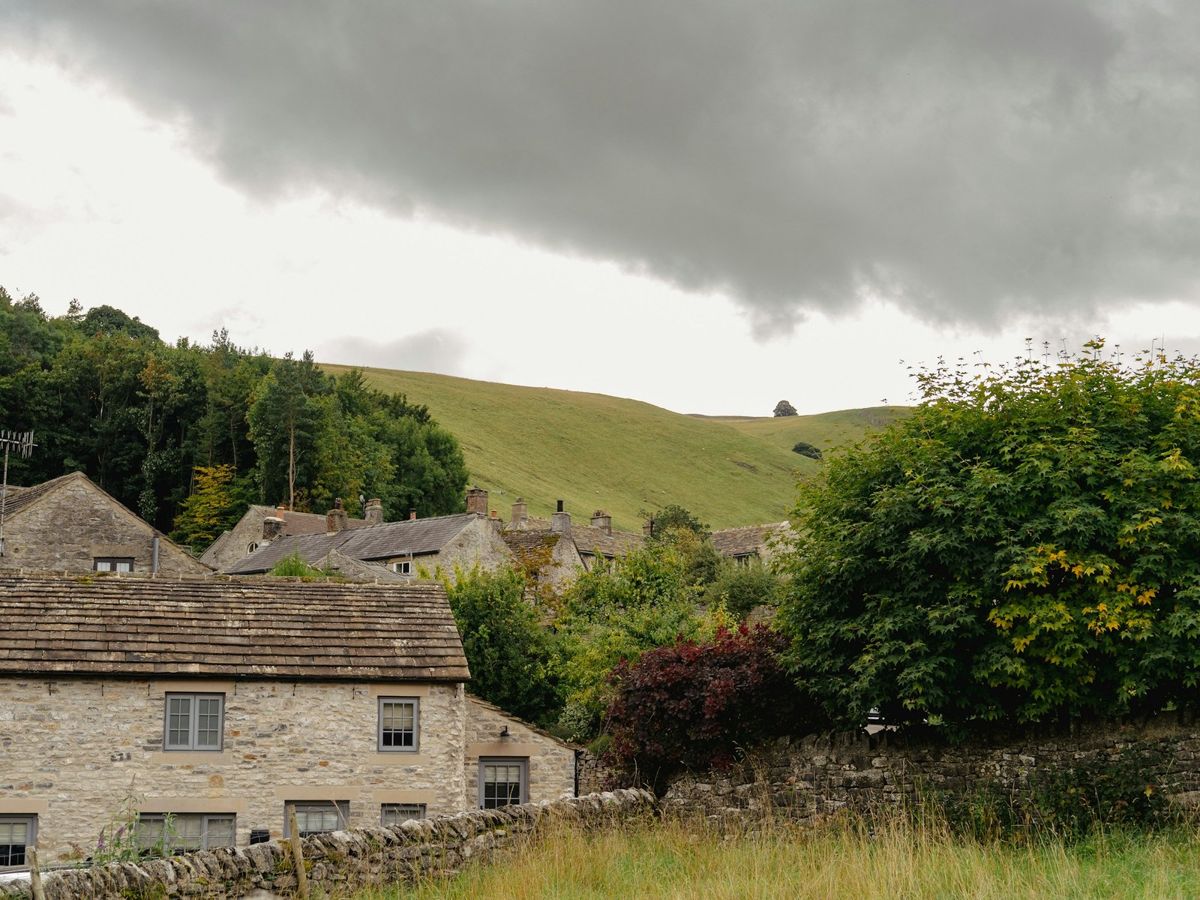Storm clouds over Yorkshire stone cottages