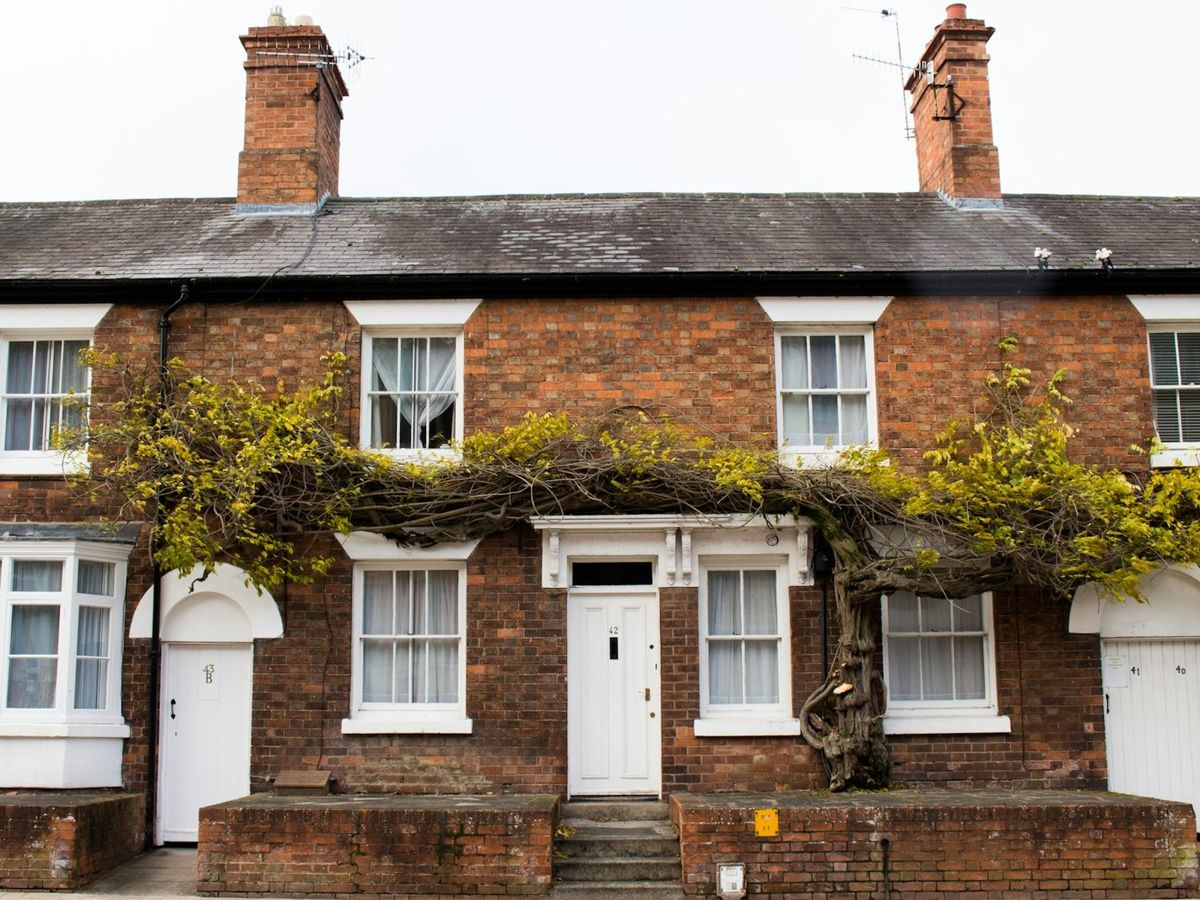 Red-brick terraced house with guttering