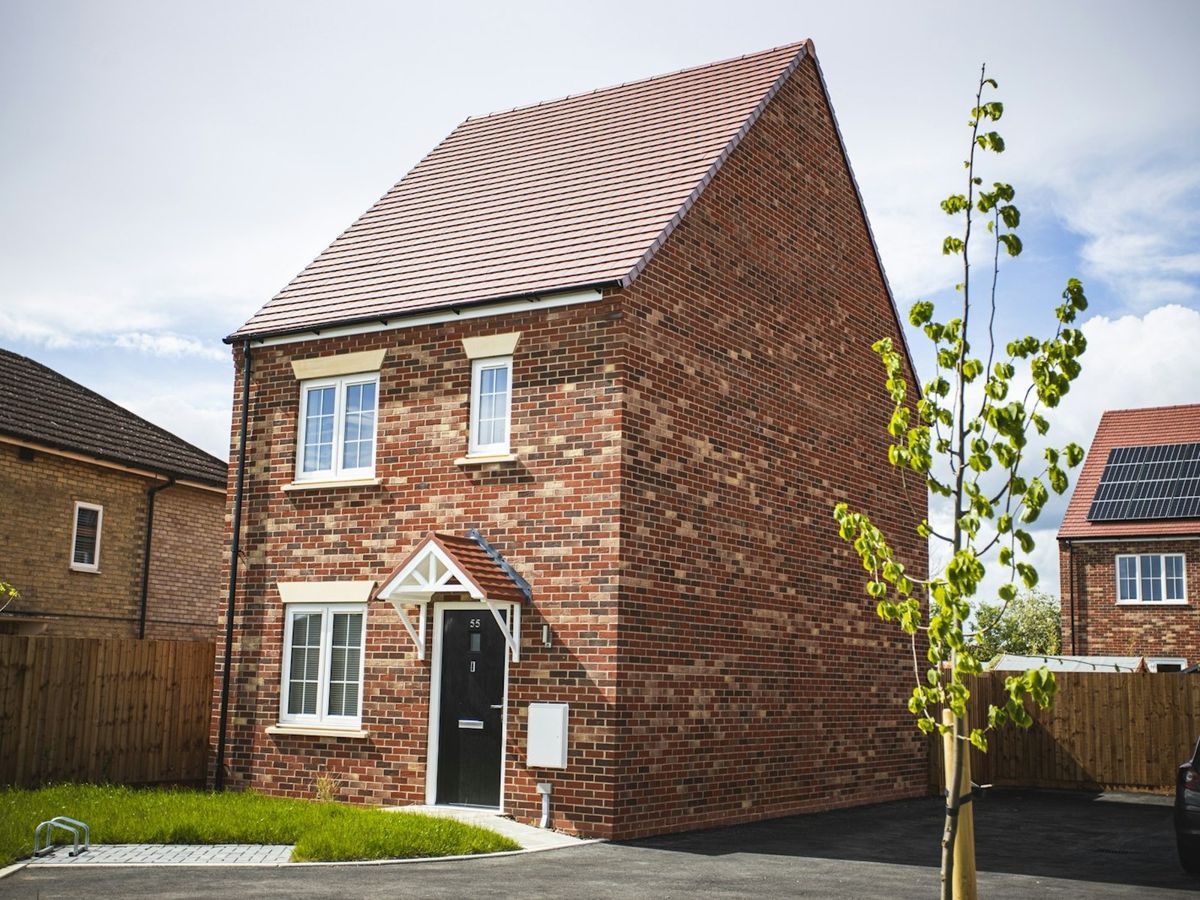 Newly roofed red-brick semi-detached house